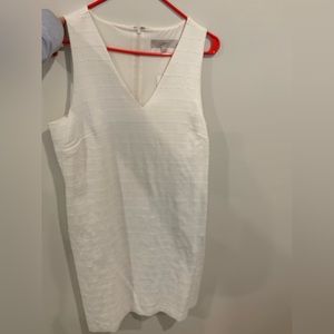 Sleeveless white dress from Loft. Texted fabric and lined (not see thru) Size 12